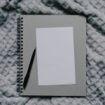 Blank page and pen on blanket