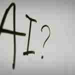 The word AI followed by a question mark in black, on white background